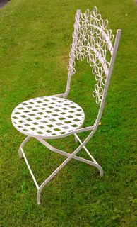 Chair. White Wrought Iron. Folding Flower Design.(total stock =2)